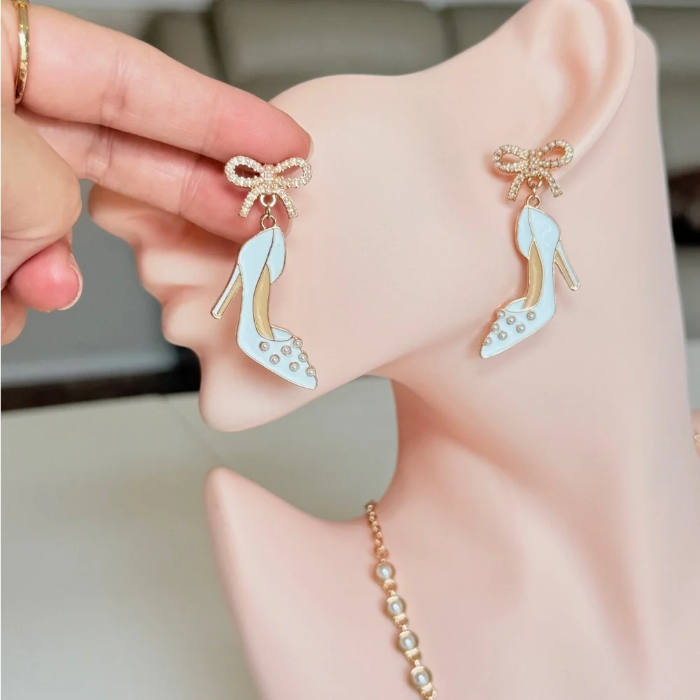 White Enamel High Heel Drop Earrings with Gold Bow